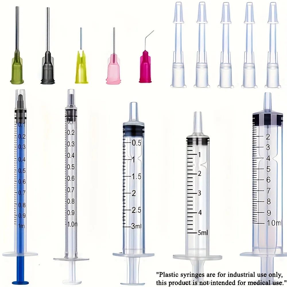 A set of precision laboratory syringes with various accessories, suitable for scientific laboratories to measure liquids.