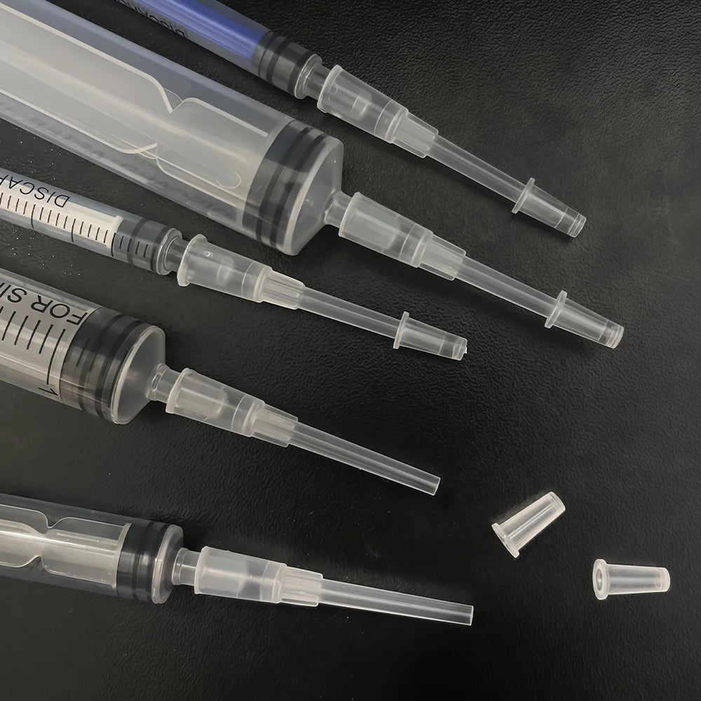 A set of precision laboratory syringes with various accessories, suitable for scientific laboratories to measure liquids.